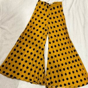 DO+BE Polka dotted flared jersey pants in yellow